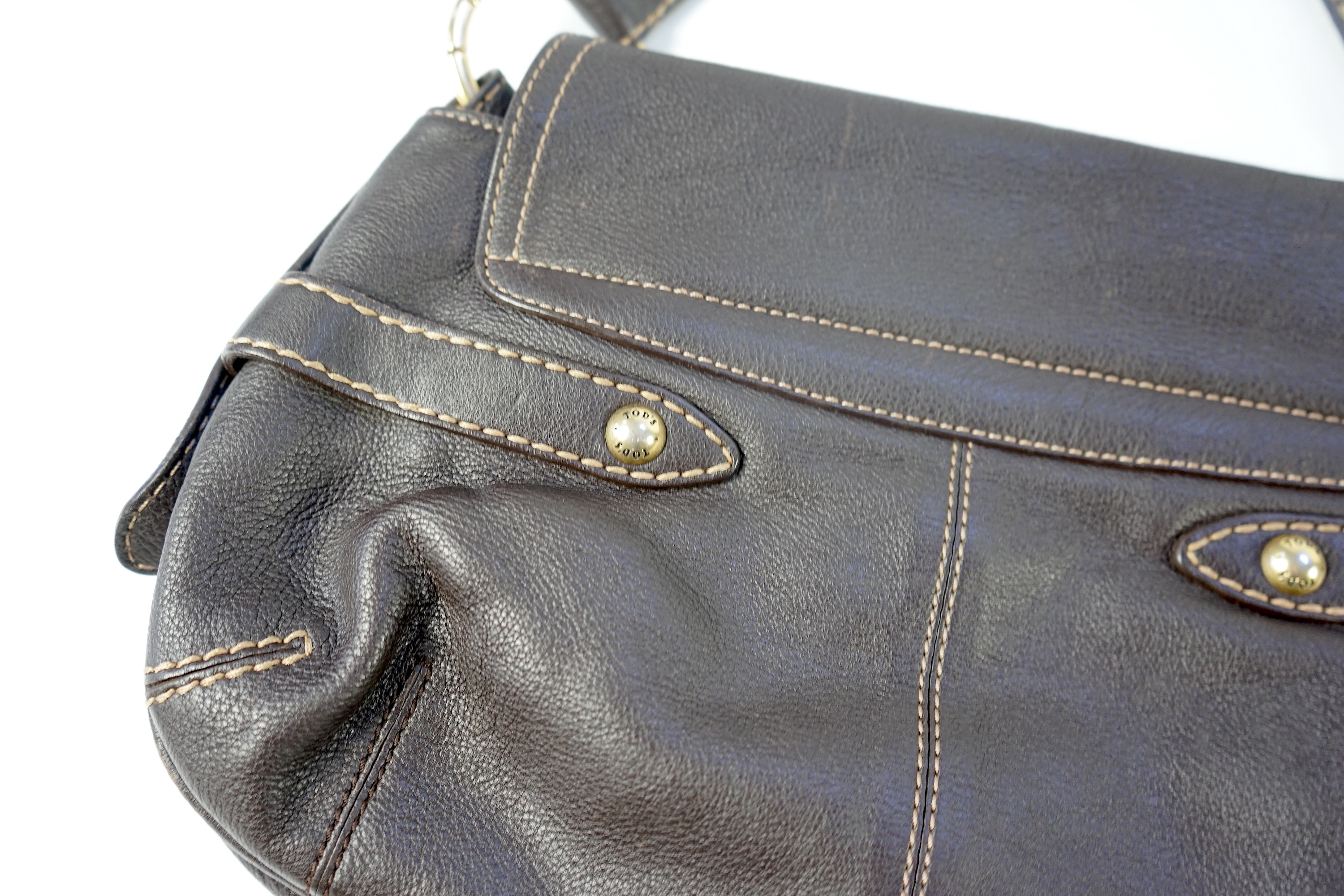 A brown leather Tod's shoulder bag with dust bag